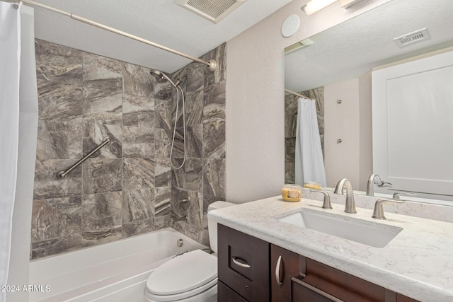 full bathroom featuring toilet, vanity, a textured ceiling, and shower / tub combo with curtain