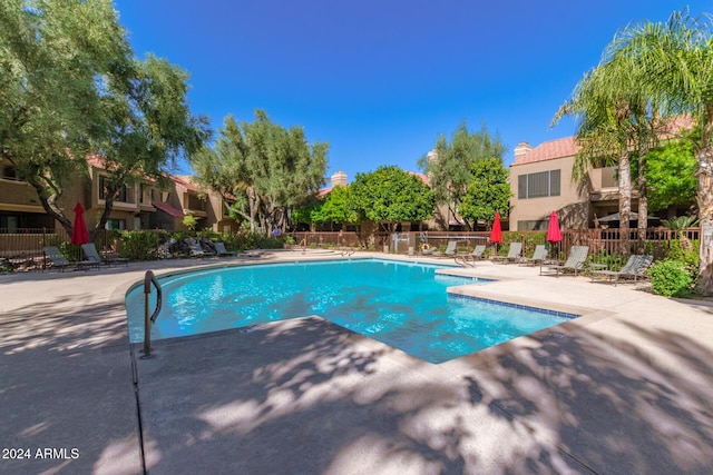 view of swimming pool with a patio area