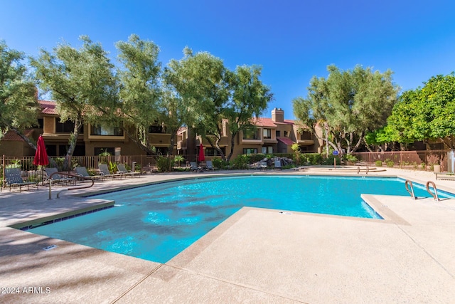 view of swimming pool with a patio area