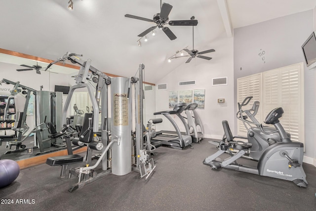 exercise room with high vaulted ceiling