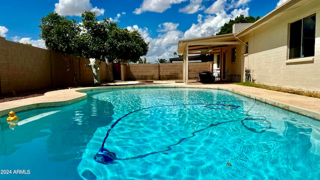 view of swimming pool with a patio