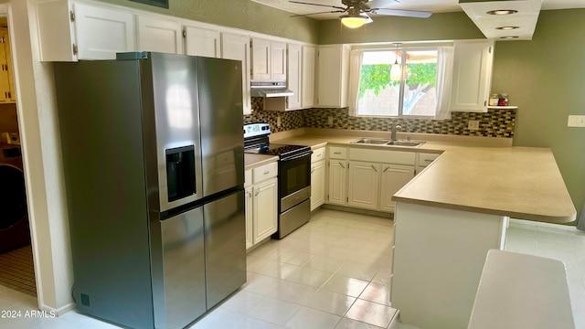 kitchen with ceiling fan, sink, tasteful backsplash, white cabinetry, and appliances with stainless steel finishes