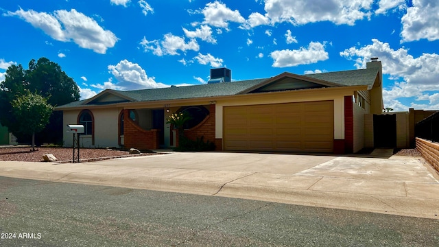 single story home with a garage