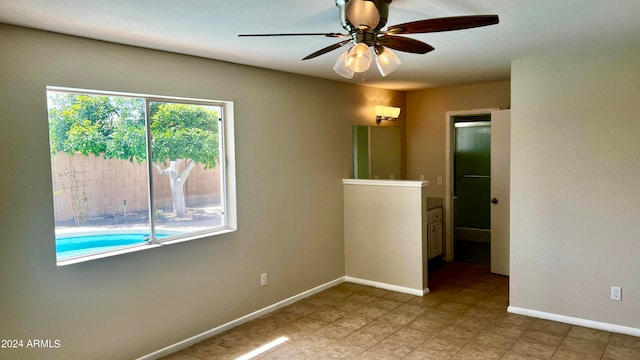 empty room featuring ceiling fan