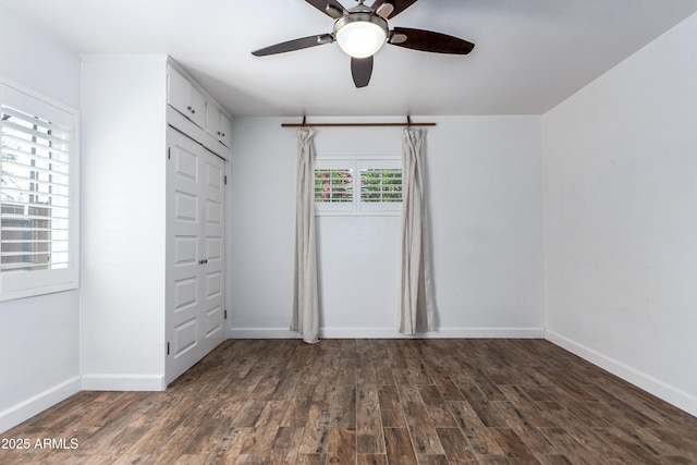 1334 W Sells Dr, Phoenix, AZ 85013 - unfurnished bedroom with wood finished floors, baseboards, a ceiling fan, and a closet