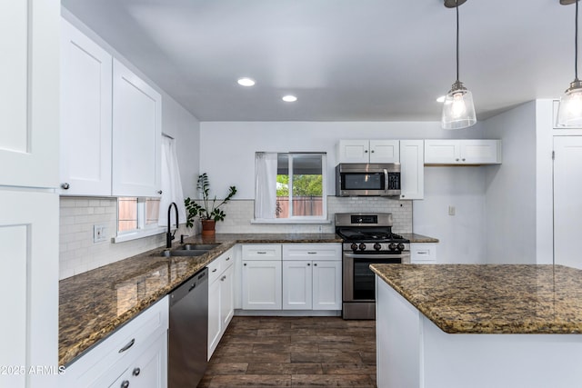 1334 W Sells Dr, Phoenix, AZ 85013 - kitchen featuring stainless steel appliances, a sink, dark wood-type flooring, white cabinetry, and recessed lighting