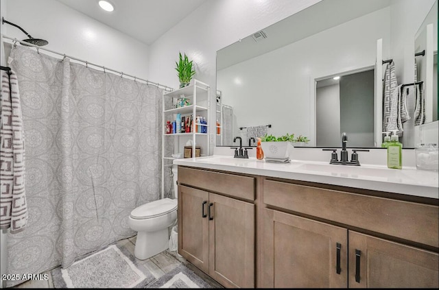 16955 W Butler Ave, Waddell, AZ 85355 - full bathroom featuring toilet, double vanity, and a shower with shower curtain