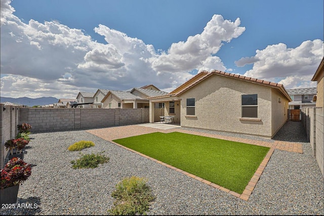 16955 W Butler Ave, Waddell, AZ 85355 - back of property featuring stucco siding, a patio, and a tile roof