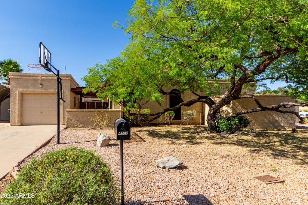 4102 W Bluefield Ave, Glendale, AZ 85308 - view of yard featuring concrete driveway and a garage