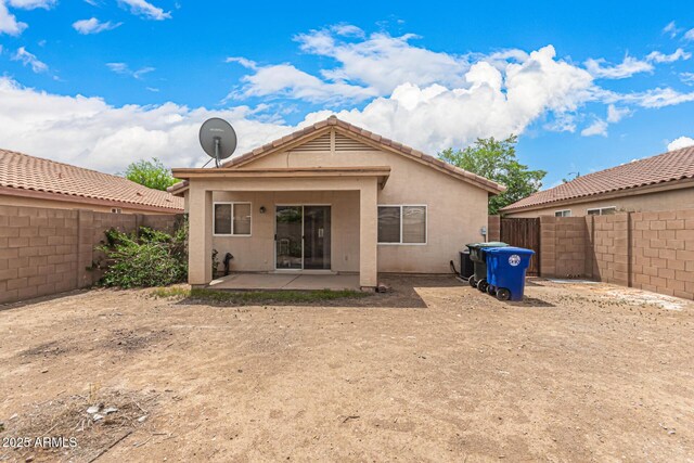 12132 W Dahlia Dr, El Mirage, AZ 85335 - rear view of house featuring a fenced backyard, stucco siding, and a patio area