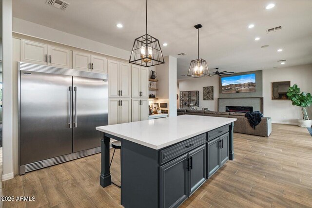 20715 E Watford Dr, Queen Creek, AZ 85142 - kitchen featuring built in fridge, white cabinetry, ceiling fan, recessed lighting, and light wood finished floors