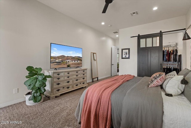 20715 E Watford Dr, Queen Creek, AZ 85142 - carpeted bedroom with a barn door, baseboards, recessed lighting, and a ceiling fan