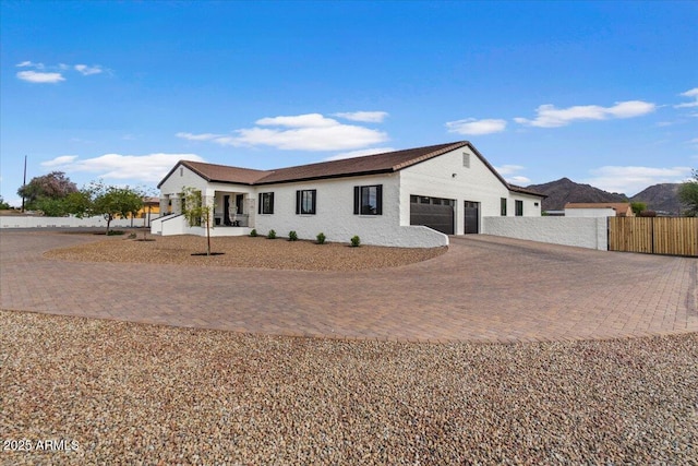 20715 E Watford Dr, Queen Creek, AZ 85142 - view of front facade with an attached garage, fence, and decorative driveway