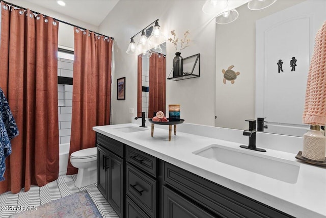 20715 E Watford Dr, Queen Creek, AZ 85142 - bathroom with toilet, double vanity, recessed lighting, tile patterned floors, and shower / bath combo
