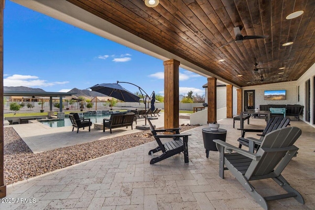 20715 E Watford Dr, Queen Creek, AZ 85142 - view of patio featuring ceiling fan, an outdoor hangout area, and a mountain view