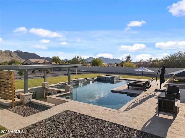 20715 E Watford Dr, Queen Creek, AZ 85142 - view of pool featuring a mountain view, a patio area, and a pool with connected hot tub