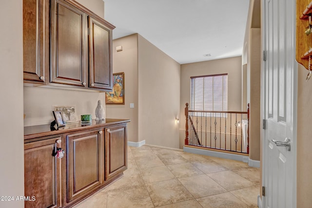 interior space featuring baseboards