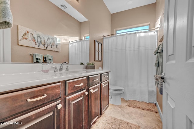 full bathroom featuring visible vents, a shower with shower curtain, toilet, vanity, and tile patterned floors