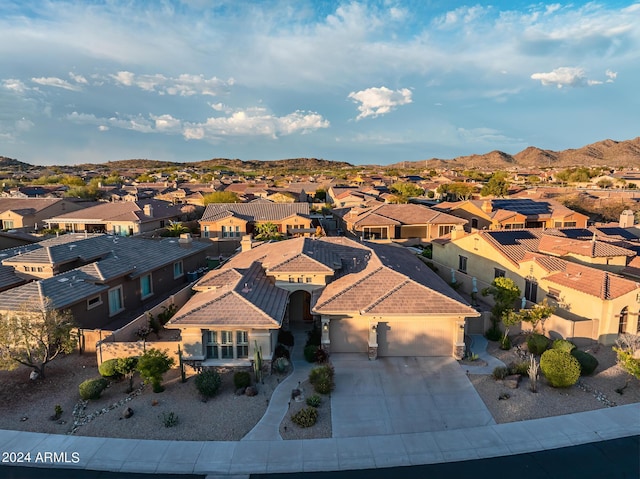 aerial view featuring a mountain view and a residential view