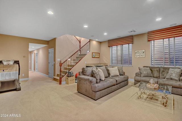 living room with visible vents, baseboards, carpet, recessed lighting, and stairs