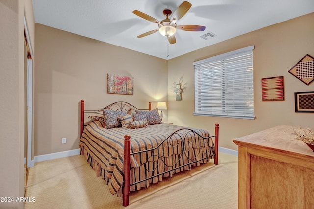 bedroom with carpet flooring, baseboards, a ceiling fan, and visible vents
