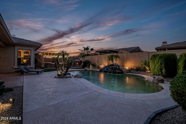 view of pool featuring a fenced backyard, a fenced in pool, and a patio area