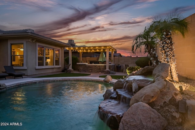 pool at dusk featuring a patio area, fence, a fenced in pool, and a pergola