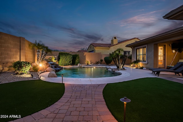 view of swimming pool featuring a fenced backyard, a fenced in pool, and a patio area
