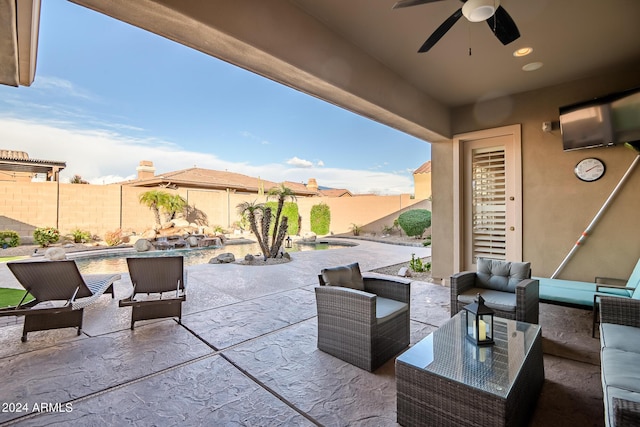 view of patio featuring a fenced backyard, outdoor lounge area, and a ceiling fan