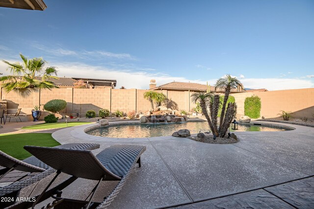 view of pool featuring a patio area and a fenced backyard
