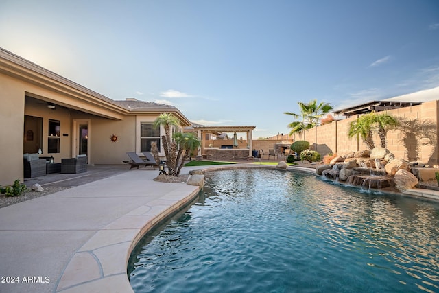 view of pool with a pergola, an outdoor hangout area, a fenced backyard, a patio area, and a fenced in pool