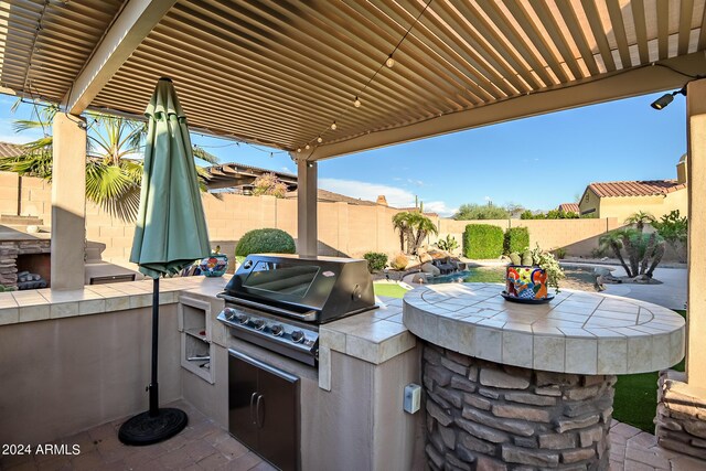 view of patio / terrace featuring a fenced backyard, a grill, and area for grilling