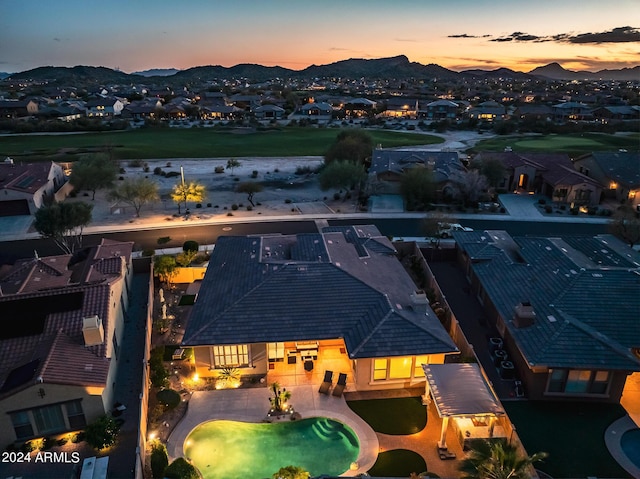 aerial view at dusk with a mountain view and a residential view