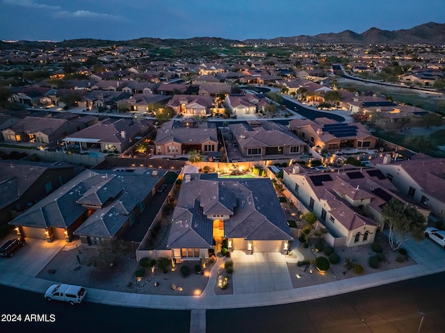 drone / aerial view featuring a mountain view and a residential view