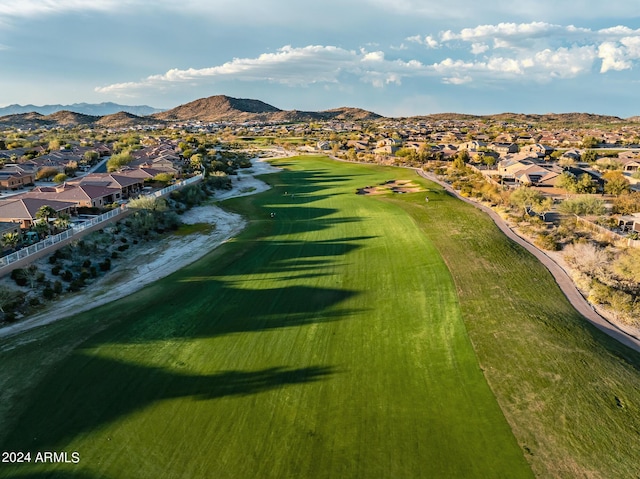 birds eye view of property with view of golf course, a residential view, and a mountain view