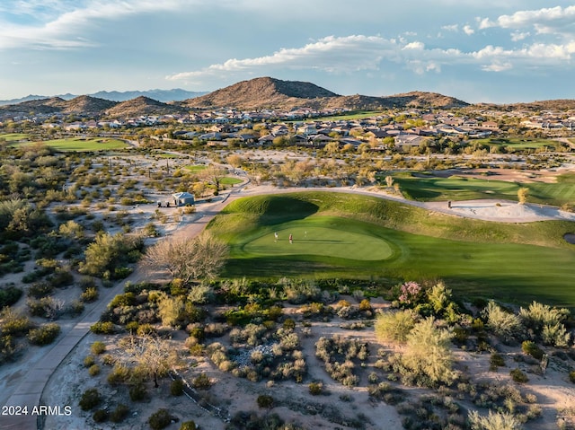 aerial view with a mountain view, view of golf course, and a residential view