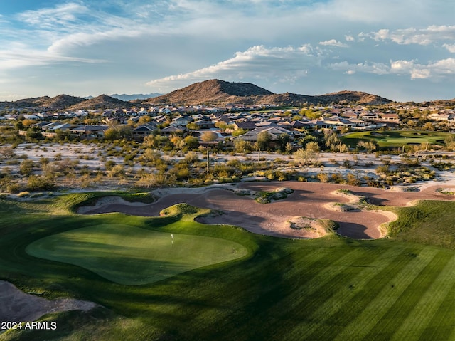 exterior space with golf course view, a mountain view, and a residential view