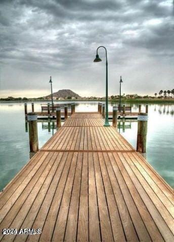 view of dock with a water view