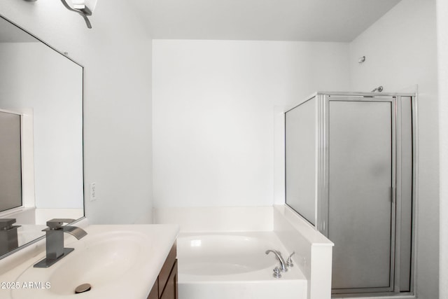 bathroom with vanity and independent shower and bath