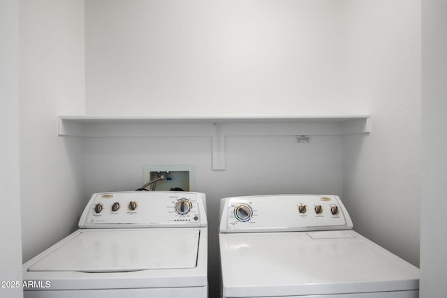 laundry room featuring separate washer and dryer