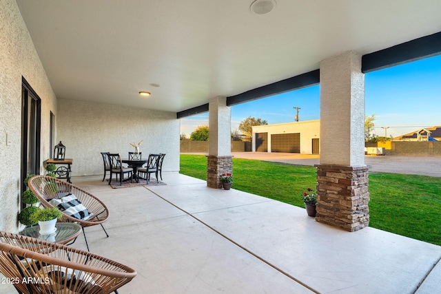 view of patio featuring fence