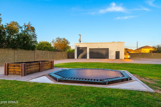 view of pool featuring a lawn and fence