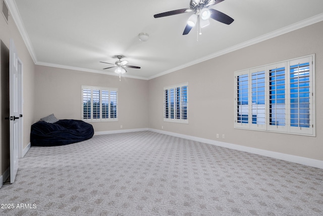 interior space with carpet, ceiling fan, baseboards, visible vents, and crown molding