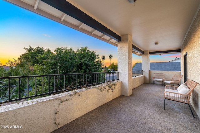 view of balcony at dusk