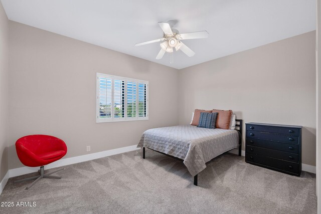 carpeted bedroom with baseboards and ceiling fan