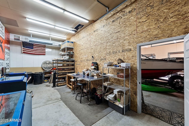 interior space featuring a workshop area and visible vents