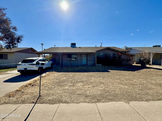 ranch-style home with a carport