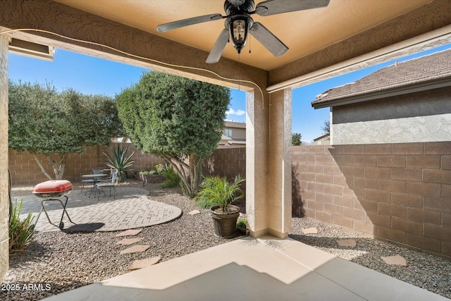 view of patio / terrace featuring ceiling fan and a fenced backyard