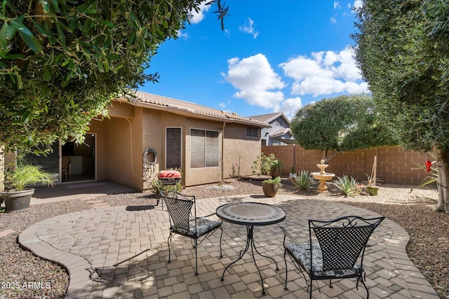 view of patio / terrace featuring fence