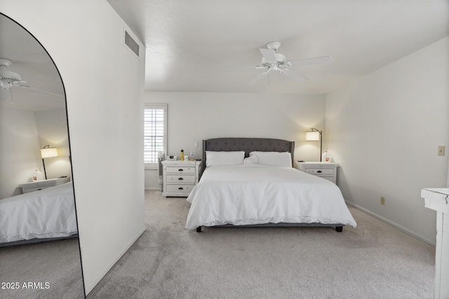 bedroom featuring light carpet and ceiling fan